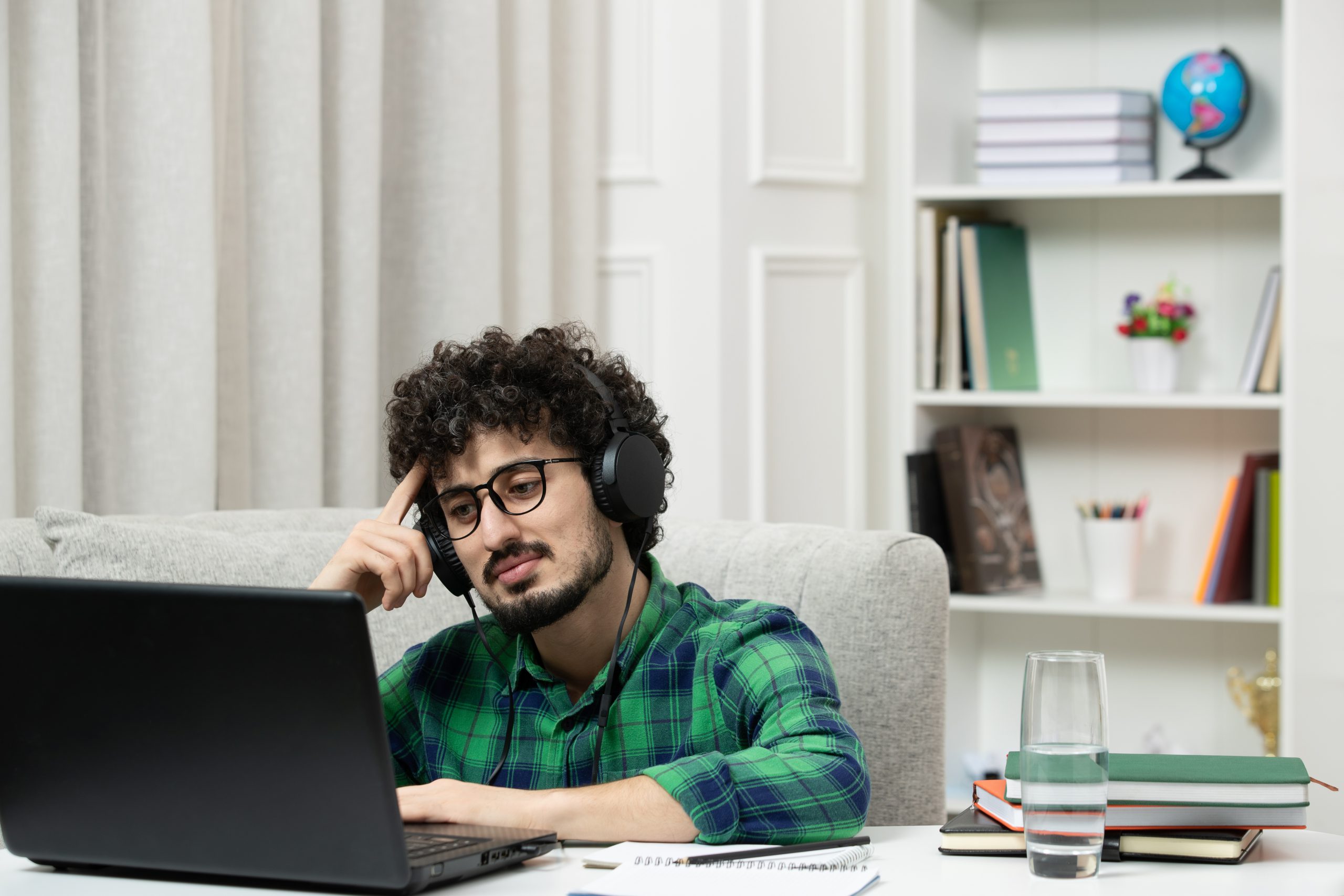 student-online-cute-young-guy-studying-computer-glasses-green-shirt-thinking